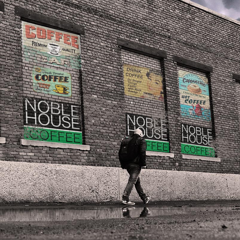 Noble House Coffee building with painted on vintage posters and advertising