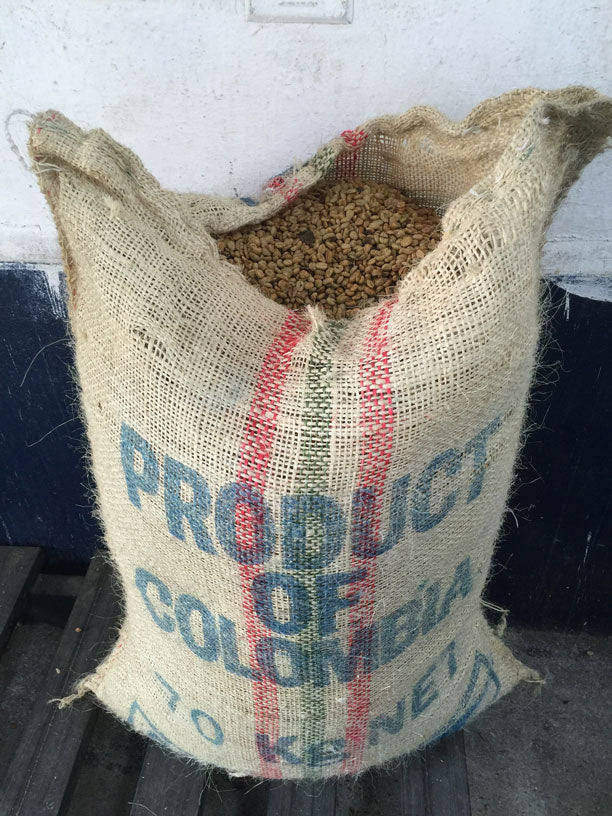 Burlap sack of green colombian coffee beans